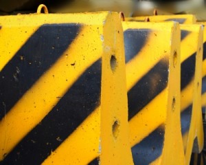 Black and yellow concrete barriers